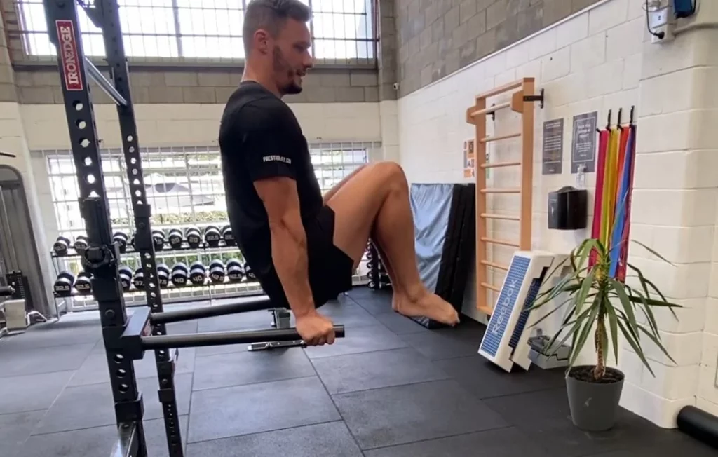 Dip Bar Leg Lifts Exercise